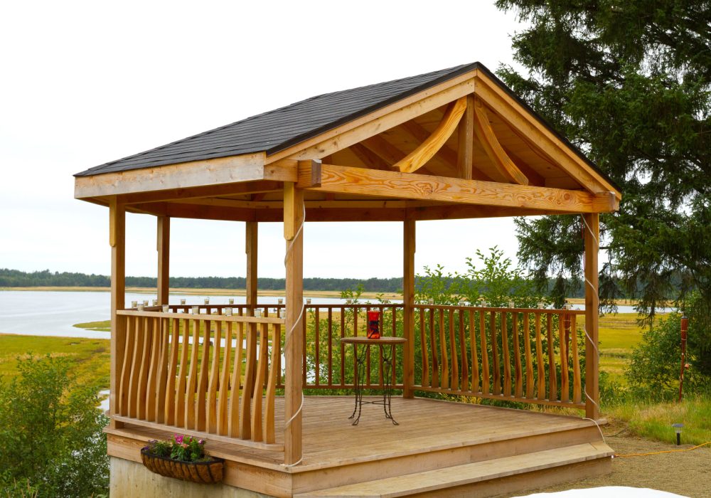 Wooden gazebo custom built on a property with a view.