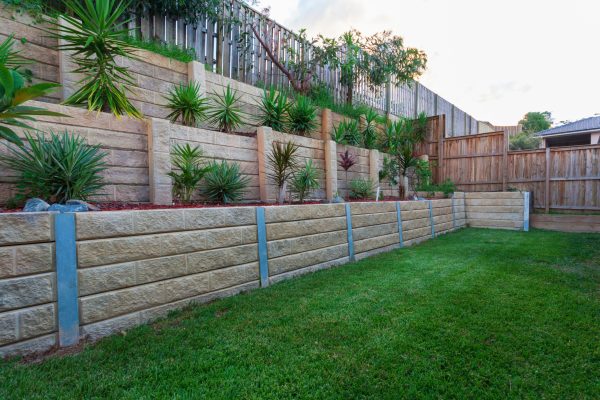 Multi level retaing wall with plants in backyard